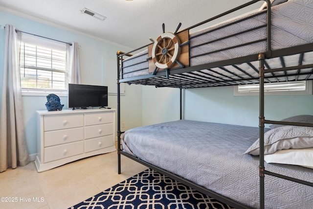 316 E Dolphin Dr, Oak Island, NC 28465 - bedroom featuring light tile patterned flooring