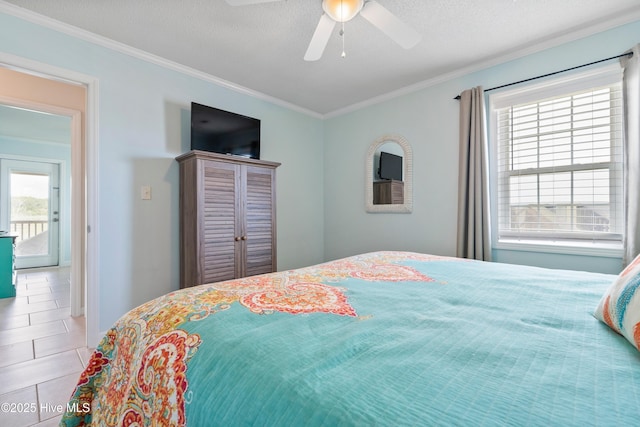 316 E Dolphin Dr, Oak Island, NC 28465 - tiled bedroom with ornamental molding and ceiling fan