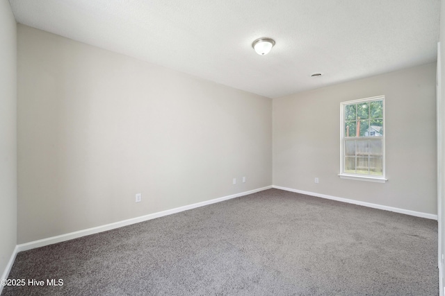 802 Mayfield Ct, Wilmington, NC 28411 - spare room featuring dark carpet and baseboards