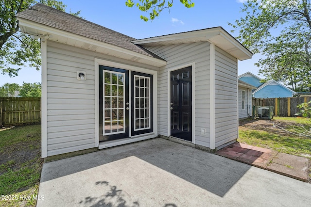 802 Mayfield Ct, Wilmington, NC 28411 - property entrance featuring a patio area and a shingled roof