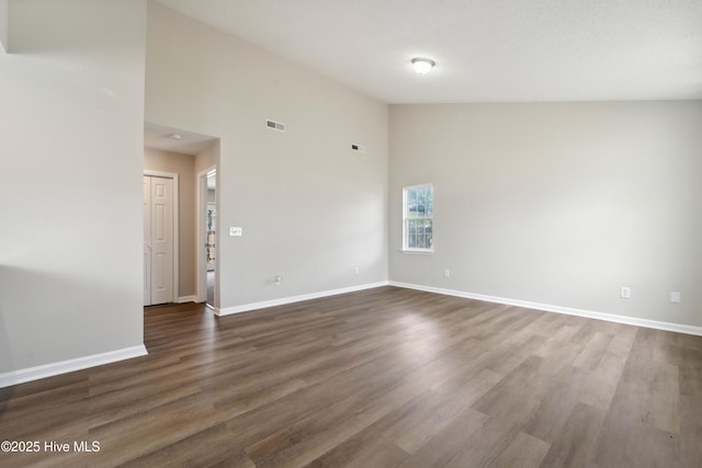 802 Mayfield Ct, Wilmington, NC 28411 - spare room featuring high vaulted ceiling and dark wood-style floors