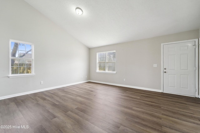 802 Mayfield Ct, Wilmington, NC 28411 - unfurnished living room with dark wood-style floors and vaulted ceiling