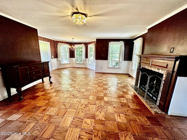 9550 NC-171, Williamston, NC 27892 - unfurnished living room with a chandelier, ornamental molding, a textured ceiling, a fireplace, and healthy amount of natural light