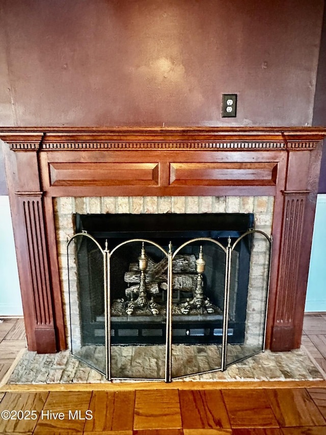 9550 NC-171, Williamston, NC 27892 - detailed view of a fireplace with flush hearth and wood finished floors