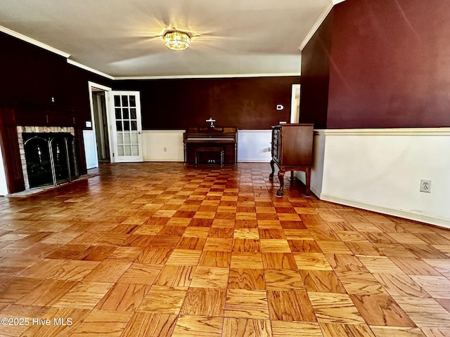 9550 NC-171, Williamston, NC 27892 - unfurnished living room with ornamental molding and a wainscoted wall