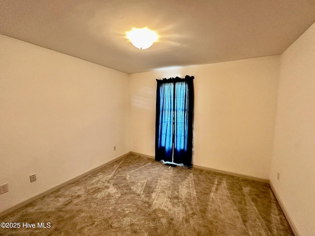9550 NC-171, Williamston, NC 27892 - spare room featuring carpet flooring and baseboards