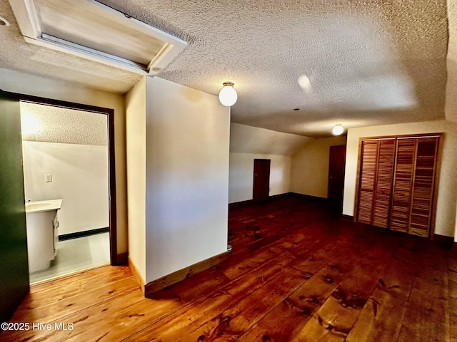 9550 NC-171, Williamston, NC 27892 - bonus room with hardwood / wood-style floors, a textured ceiling, and lofted ceiling