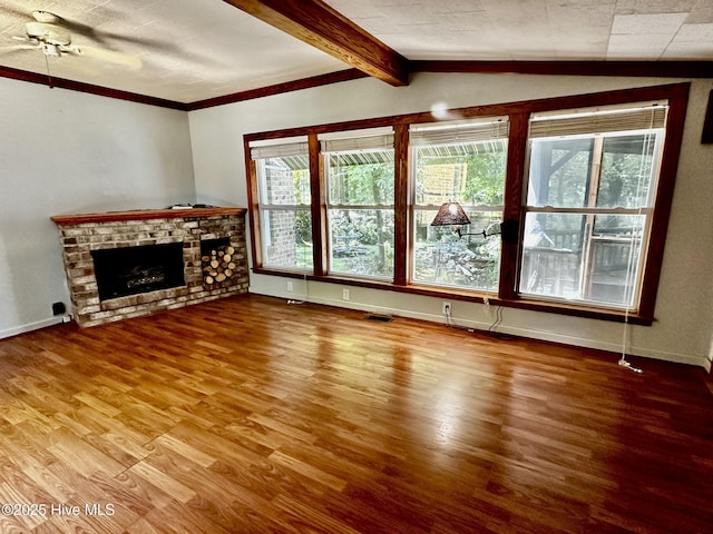 9550 NC-171, Williamston, NC 27892 - unfurnished living room featuring wood finished floors, a brick fireplace, ceiling fan, and ornamental molding