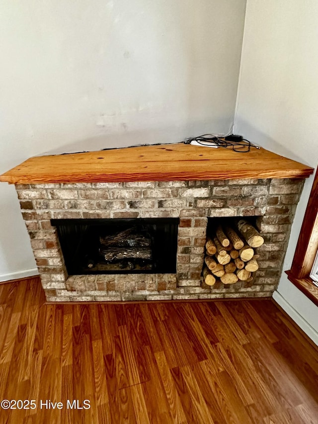 9550 NC-171, Williamston, NC 27892 - detailed view of a brick fireplace and wood finished floors