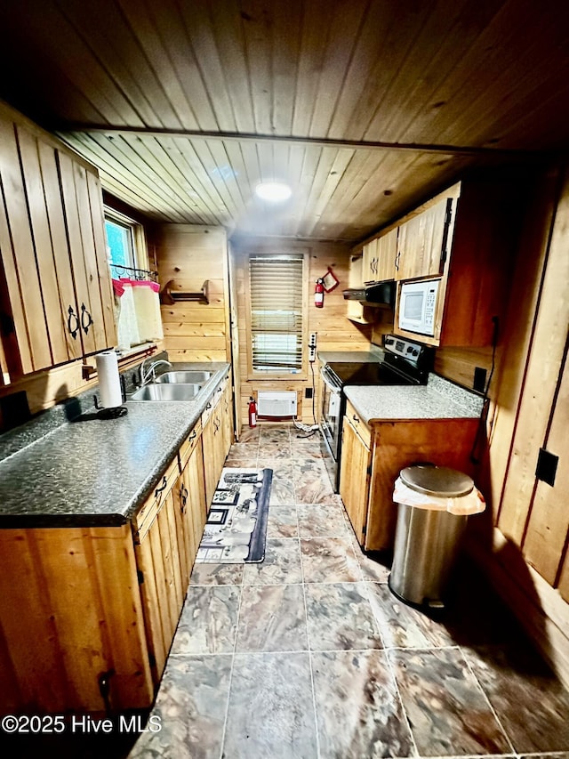 9550 NC-171, Williamston, NC 27892 - kitchen featuring stainless steel electric range, wooden walls, white microwave, ventilation hood, and wooden ceiling