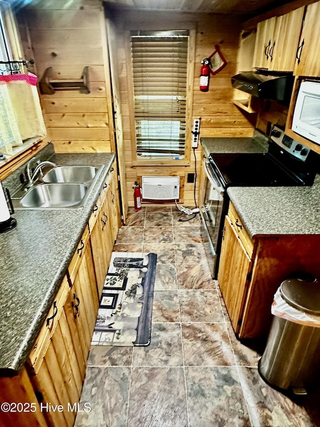 9550 NC-171, Williamston, NC 27892 - kitchen with wood walls, black range with electric stovetop, white microwave, and stone finish floors