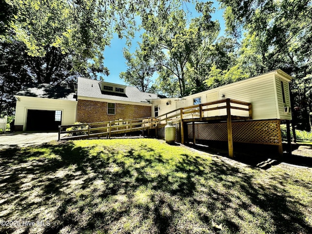 9550 NC-171, Williamston, NC 27892 - rear view of house with a garage, brick siding, and a wooden deck
