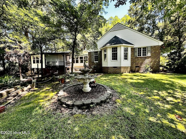 9550 NC-171, Williamston, NC 27892 - rear view of property featuring crawl space, a yard, and a wooden deck