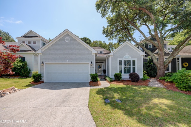 8508 Hammock Dunes Dr, Wilmington, NC 28411 - view of front of home featuring an attached garage, concrete driveway, and a front lawn