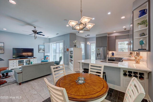 8508 Hammock Dunes Dr, Wilmington, NC 28411 - dining space featuring healthy amount of natural light, recessed lighting, a chandelier, and a ceiling fan