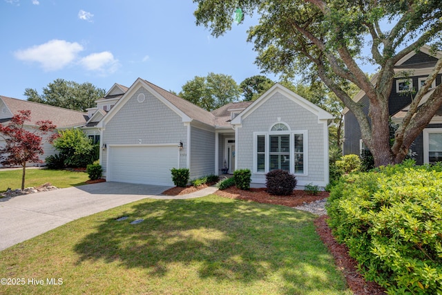 8508 Hammock Dunes Dr, Wilmington, NC 28411 - view of front of house with a garage, concrete driveway, and a front lawn