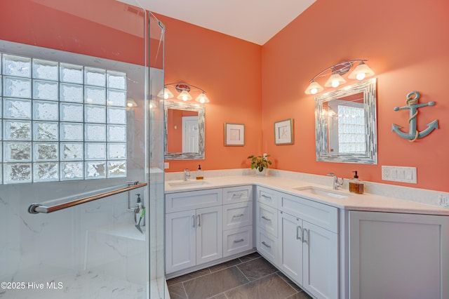 8508 Hammock Dunes Dr, Wilmington, NC 28411 - full bath featuring double vanity, healthy amount of natural light, and a marble finish shower