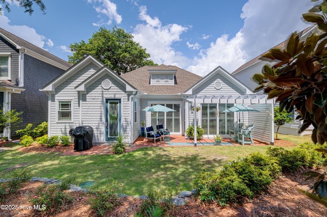 8508 Hammock Dunes Dr, Wilmington, NC 28411 - back of house with a pergola, a yard, a patio, and roof with shingles