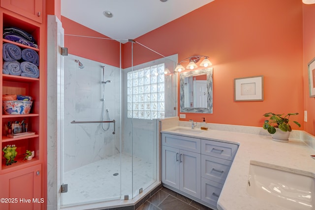 8508 Hammock Dunes Dr, Wilmington, NC 28411 - full bathroom featuring vanity, a marble finish shower, vaulted ceiling, and built in features