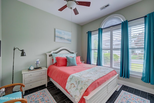 8508 Hammock Dunes Dr, Wilmington, NC 28411 - bedroom with a ceiling fan and wood finish floors