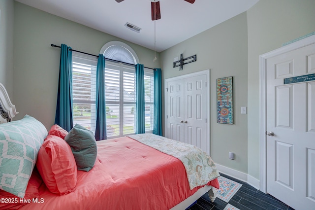 8508 Hammock Dunes Dr, Wilmington, NC 28411 - bedroom with wood tiled floors, a closet, and ceiling fan