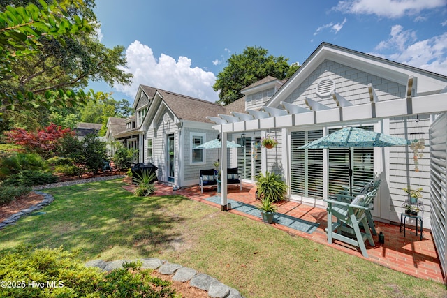 8508 Hammock Dunes Dr, Wilmington, NC 28411 - rear view of house with a pergola, a patio, a lawn, and a shingled roof