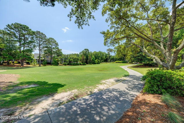 8508 Hammock Dunes Dr, Wilmington, NC 28411 - surrounding community with a lawn, view of scattered trees, and golf course view