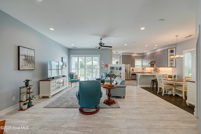8508 Hammock Dunes Dr, Wilmington, NC 28411 - living room with a ceiling fan, recessed lighting, and a chandelier