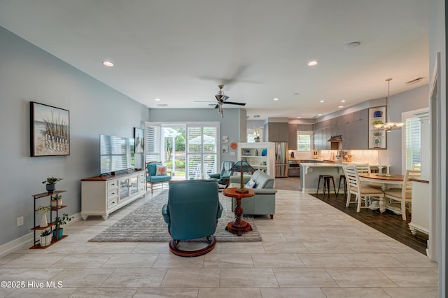 8508 Hammock Dunes Dr, Wilmington, NC 28411 - living area with a ceiling fan, a chandelier, and recessed lighting