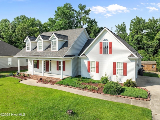 2639 Plumosa Dr, Grimesland, NC 27837 - cape cod house with roof with shingles, a porch, and a front lawn