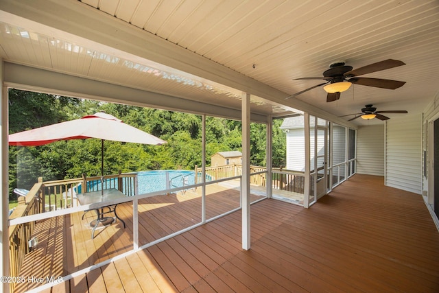 2639 Plumosa Dr, Grimesland, NC 27837 - wooden terrace featuring a storage shed, an outdoor pool, and a ceiling fan