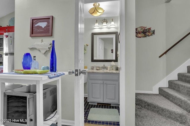 1785 New River Inlet Rd Unit 2, North Topsail Beach, NC 28460 - bathroom with vanity and tile patterned flooring