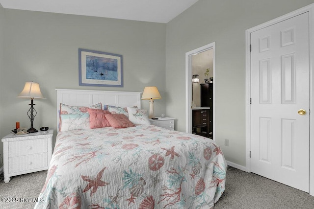 1785 New River Inlet Rd Unit 2, North Topsail Beach, NC 28460 - carpeted bedroom featuring ensuite bath and baseboards