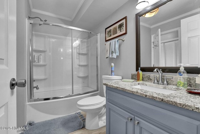 1785 New River Inlet Rd Unit 2, North Topsail Beach, NC 28460 - bathroom with vanity, enclosed tub / shower combo, ornamental molding, and wood finished floors