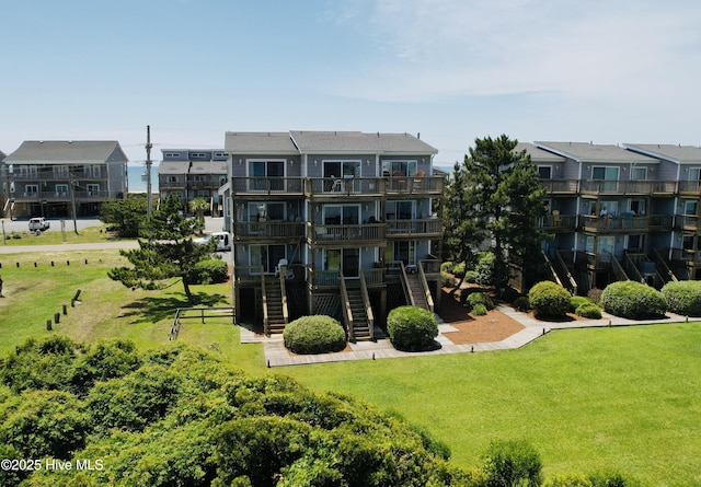 1785 New River Inlet Rd Unit 2, North Topsail Beach, NC 28460 - view of apartment building / complex featuring stairway