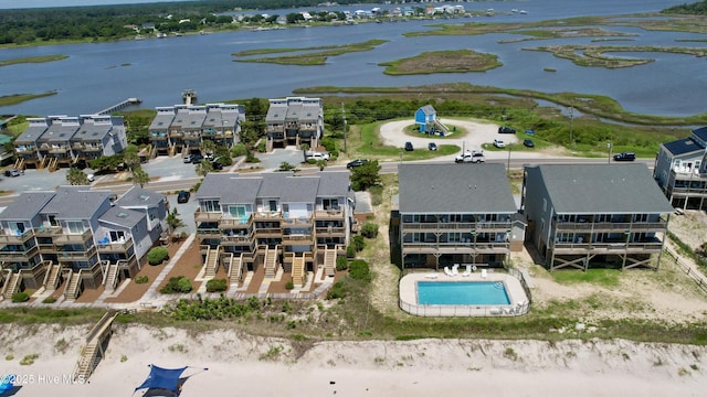 1785 New River Inlet Rd Unit 2, North Topsail Beach, NC 28460 - aerial perspective of suburban area featuring a nearby body of water and a pool area
