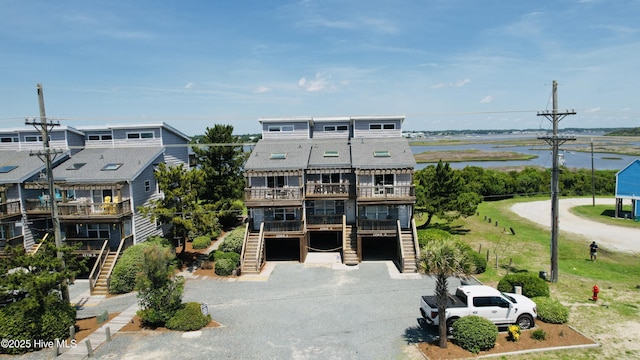 1785 New River Inlet Rd Unit 2, North Topsail Beach, NC 28460 - view of property featuring stairs, an attached garage, and driveway