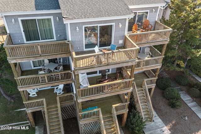1785 New River Inlet Rd Unit 2, North Topsail Beach, NC 28460 - rear view of house with roof with shingles, stairs, and a wooden deck