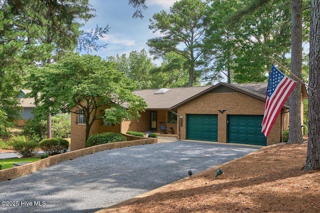120 Shagbark Ct, Seven Lakes, NC 27376 - ranch-style home with asphalt driveway, an attached garage, and brick siding