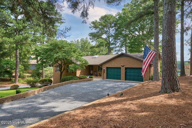 120 Shagbark Ct, Seven Lakes, NC 27376 - ranch-style house featuring asphalt driveway, an attached garage, and brick siding