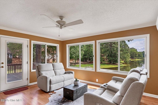 120 Shagbark Ct, Seven Lakes, NC 27376 - living area featuring a ceiling fan, wood finished floors, ornamental molding, and a textured ceiling