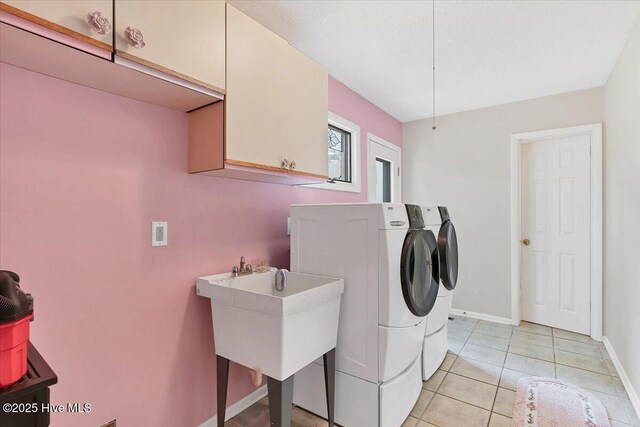 120 Shagbark Ct, Seven Lakes, NC 27376 - laundry area with cabinet space, separate washer and dryer, and light tile patterned floors