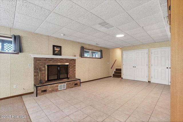 120 Shagbark Ct, Seven Lakes, NC 27376 - basement with stairs, a fireplace, and a paneled ceiling