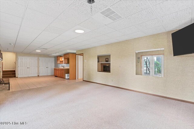 120 Shagbark Ct, Seven Lakes, NC 27376 - unfurnished living room featuring light carpet and a sink