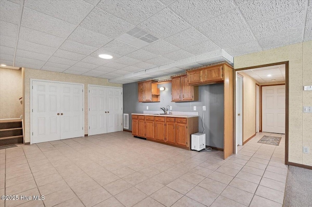 120 Shagbark Ct, Seven Lakes, NC 27376 - kitchen featuring light countertops and brown cabinets