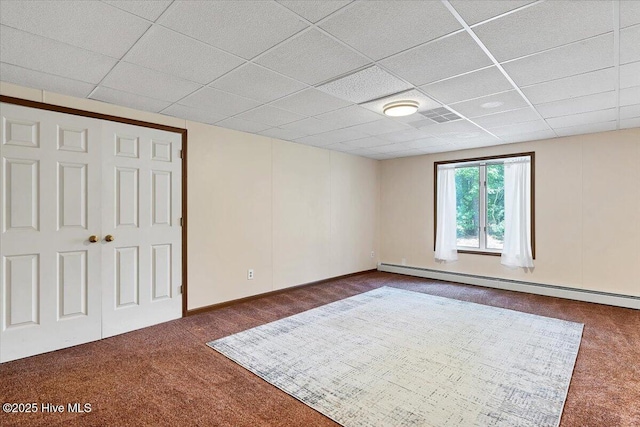120 Shagbark Ct, Seven Lakes, NC 27376 - unfurnished bedroom featuring dark colored carpet, a paneled ceiling, a baseboard radiator, and a closet