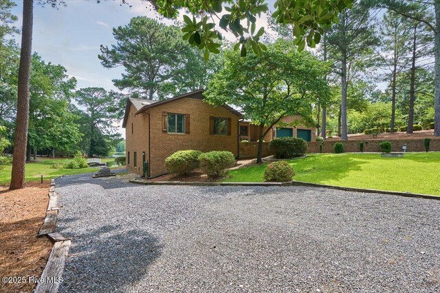 120 Shagbark Ct, Seven Lakes, NC 27376 - view of front of home featuring a front yard and brick siding