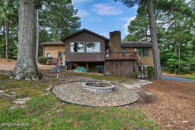 120 Shagbark Ct, Seven Lakes, NC 27376 - rear view of property featuring stairway, a chimney, a deck, and brick siding