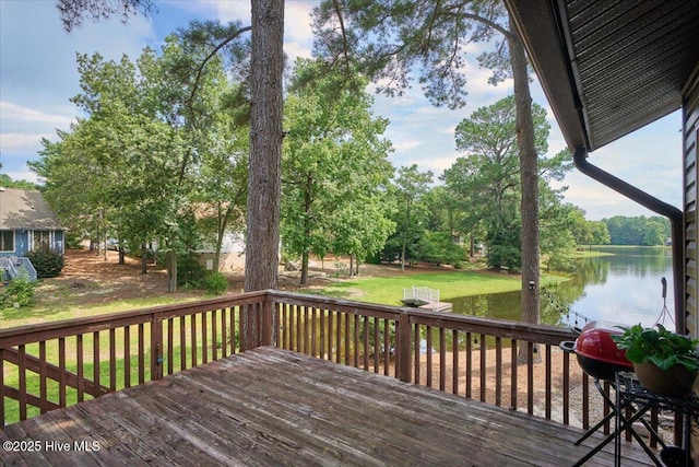120 Shagbark Ct, Seven Lakes, NC 27376 - wooden terrace with a water view, a grill, a lawn, and view of wooded area