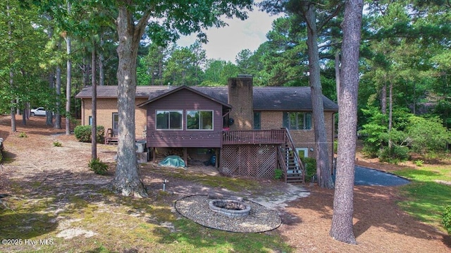 120 Shagbark Ct, Seven Lakes, NC 27376 - back of house with stairs, a chimney, a wooden deck, and a fire pit